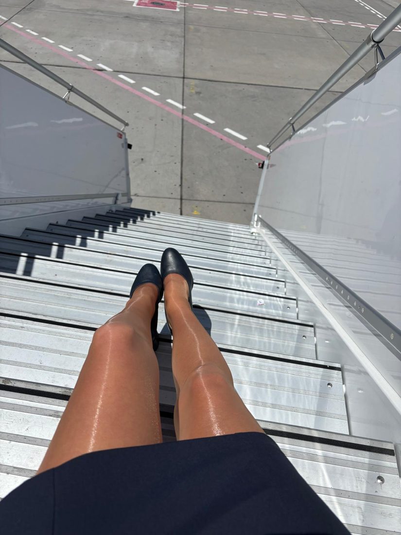 Cabin crew legs on aircraft steps